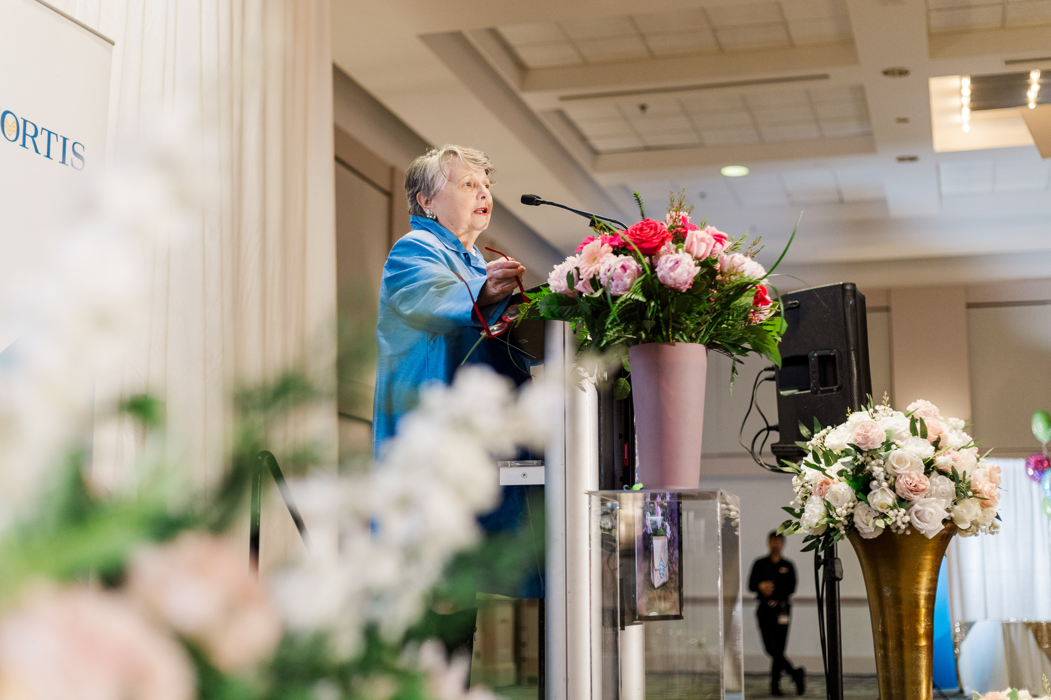 Speaker addressing guests at Brunch with the Bags