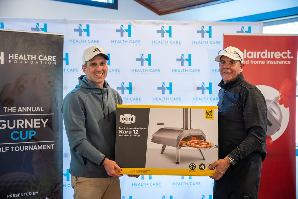Golfers receiving a prize at the 2026 Gurney Cup Golf Tournament