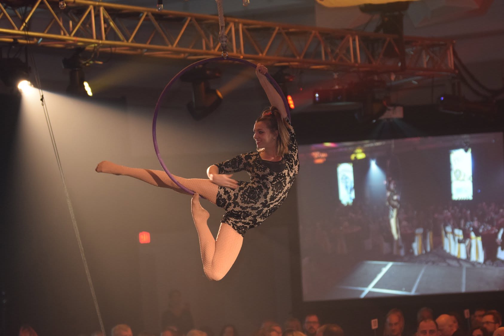 Aerial acrobat performing at a Health Care Foundation gala