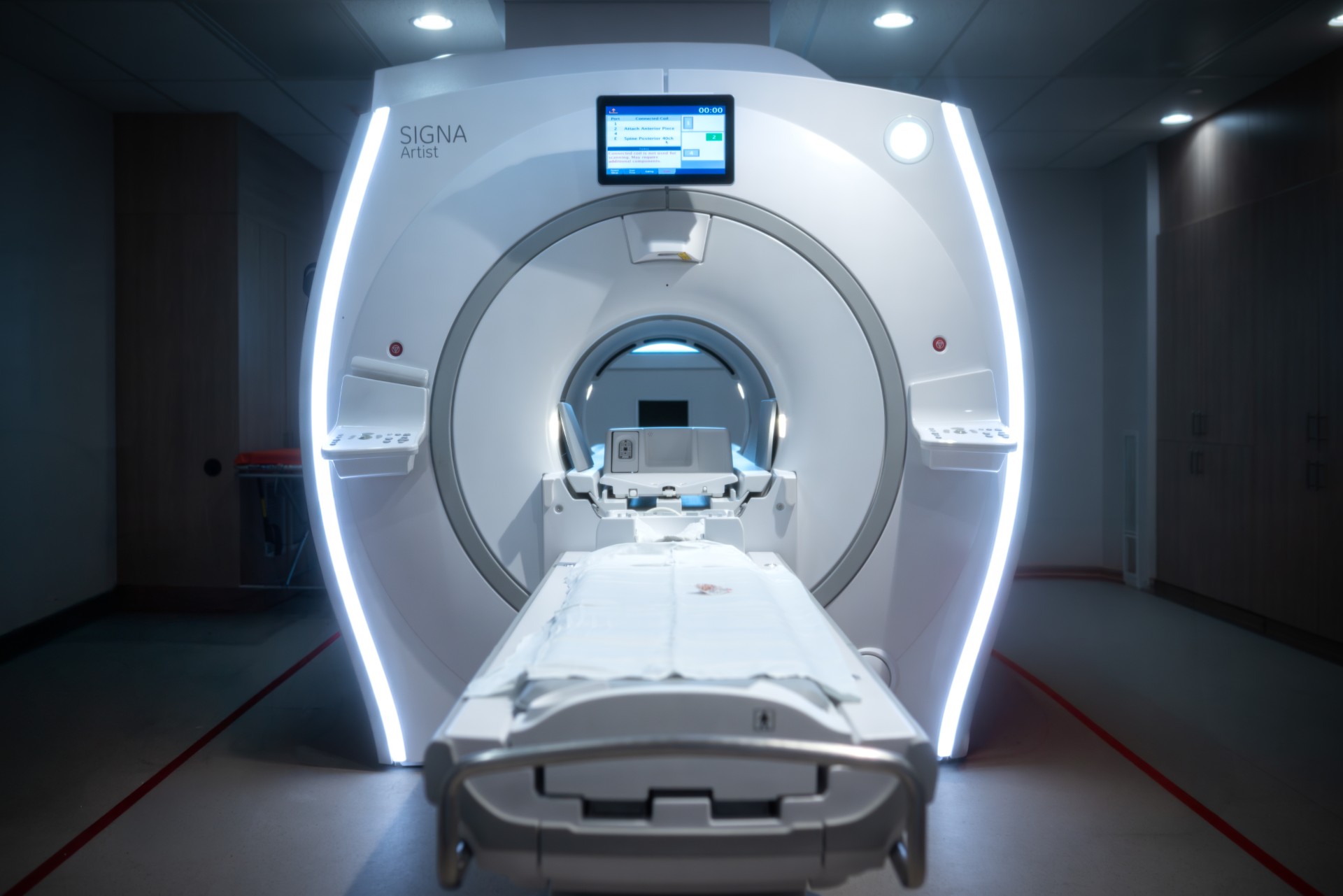 MRI scanner with an illuminated bore in an imaging room