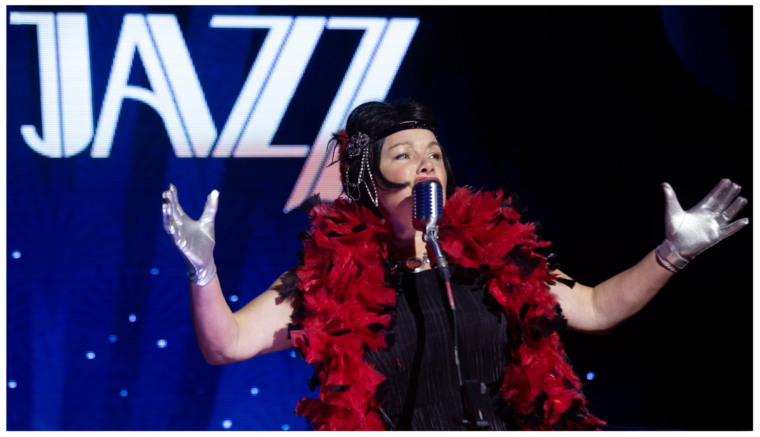 Jazz singer performing on stage at a Health Care Foundation gala