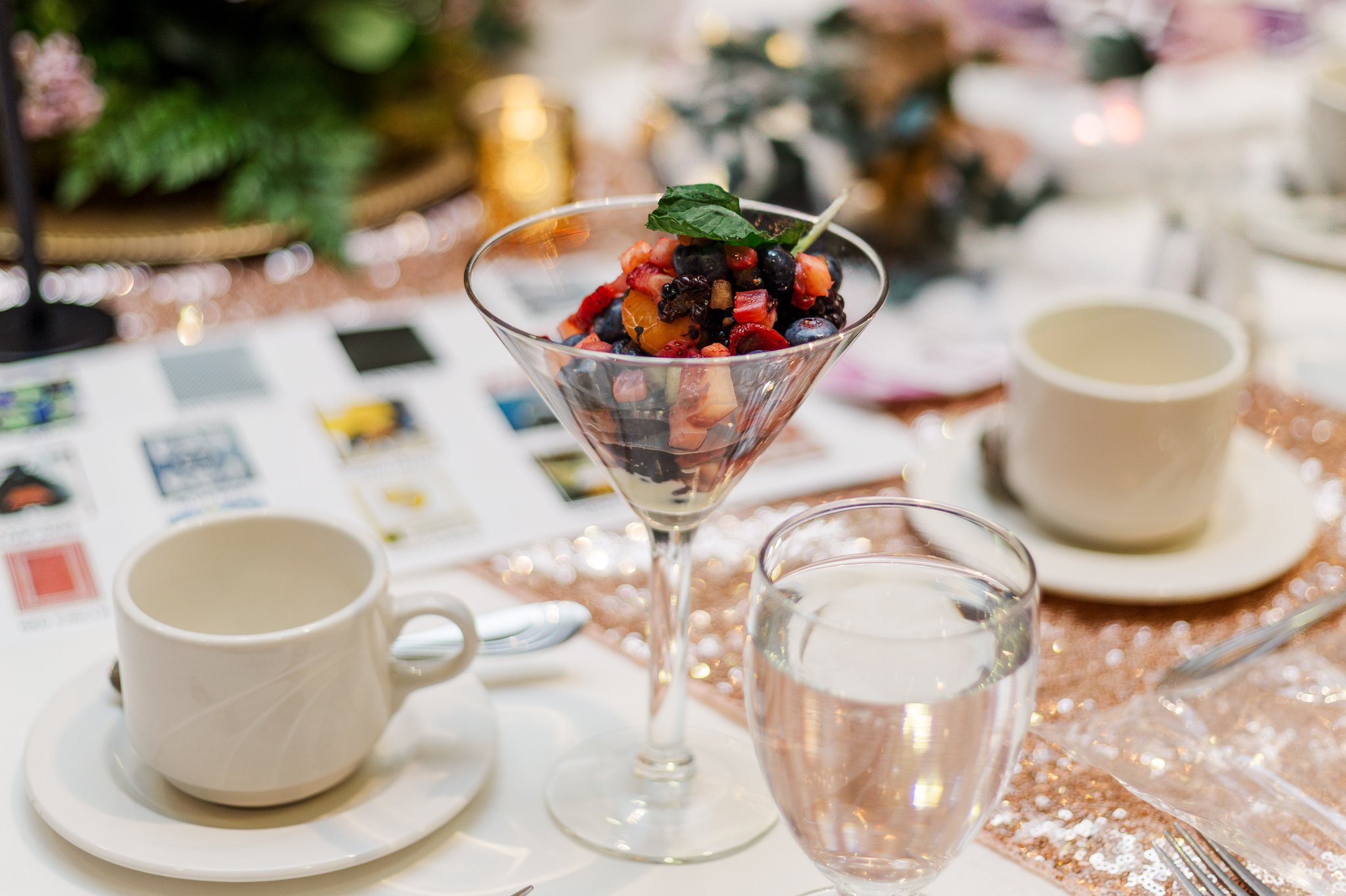 Table setting with tea cups and desserts at Brunch with the Bags