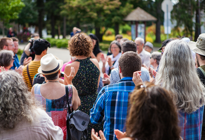 Crowd gathered outdoors at a community fundraising event