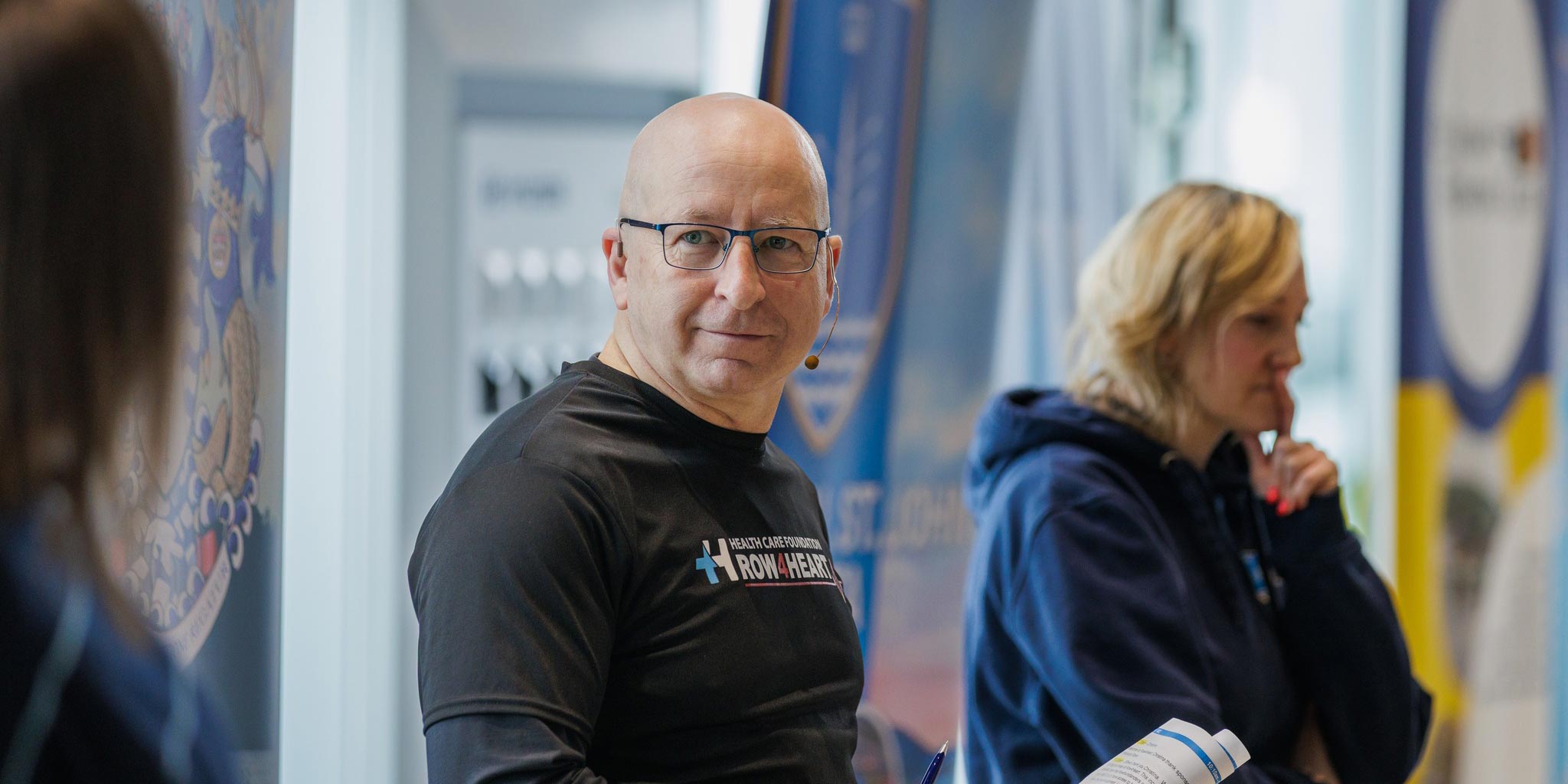 Steve Callahan sitting with a family member in a hospital setting