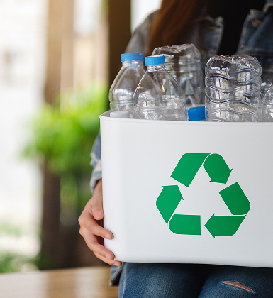 Recycling bin filled with empty plastic bottles
